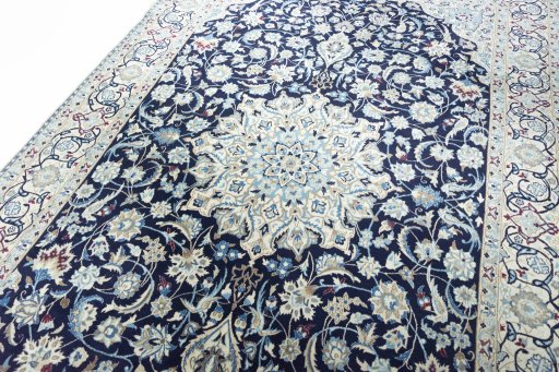 Backside of handmade 2000s Nain rug showing knot structure and weave density