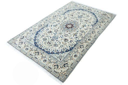 Corner detail of 2000s Nain rug showing border pattern and Wool pile