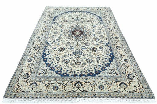 Surface texture of 2000s Nain rug with natural Wool and intricate pattern