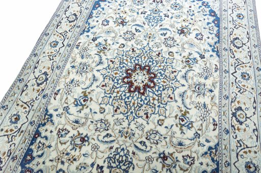 Backside of handmade 2000s Nain rug showing knot structure and weave density