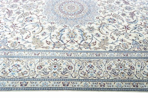 Corner detail of 2000s Nain rug showing border pattern and Wool pile