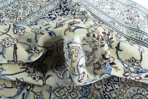 Surface texture of 2000s Nain rug with natural Wool and intricate pattern