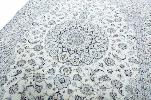 Backside of handmade New Nain rug showing knot structure and weave density