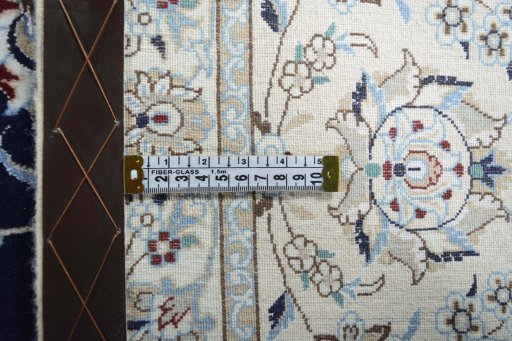 Backside of handmade New Nain rug showing knot structure and weave density