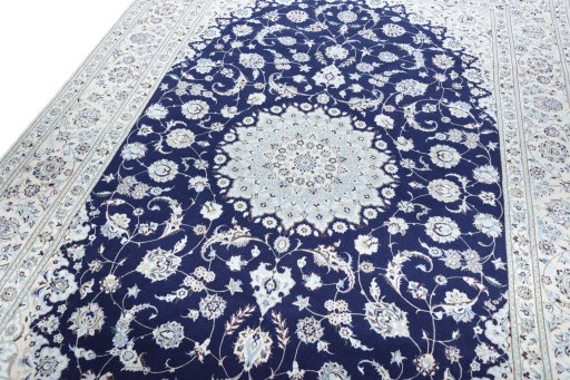 Backside of handmade New Nain rug showing knot structure and weave density