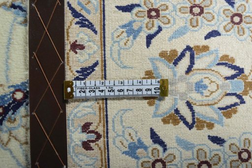 Backside of handmade New Nain rug showing knot structure and weave density