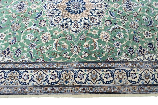 Corner detail of New Nain rug showing border pattern and Cork pile