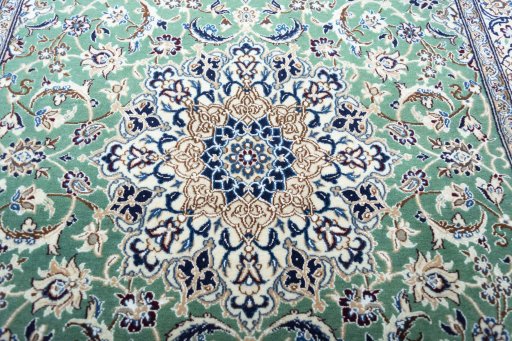 Central medallion detail of New Nain rug from Iran / Persia
