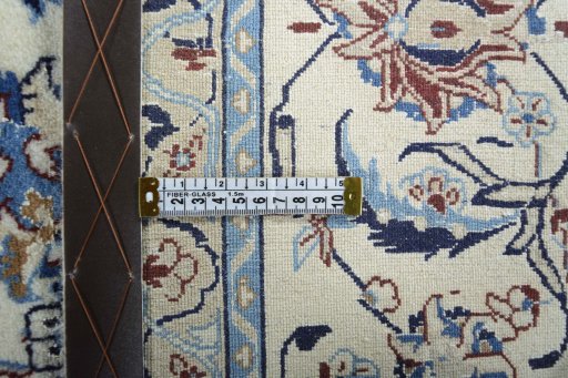 Backside of handmade New Nain rug showing knot structure and weave density