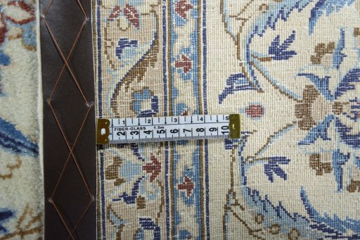 Backside of handmade New Nain rug showing knot structure and weave density