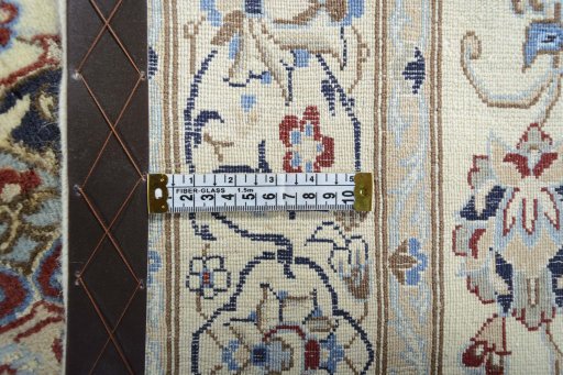 Backside of handmade New Nain rug showing knot structure and weave density