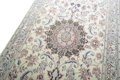 Backside of handmade New Nain rug showing knot structure and weave density
