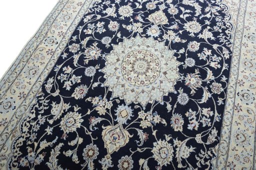 Backside of handmade New Nain rug showing knot structure and weave density