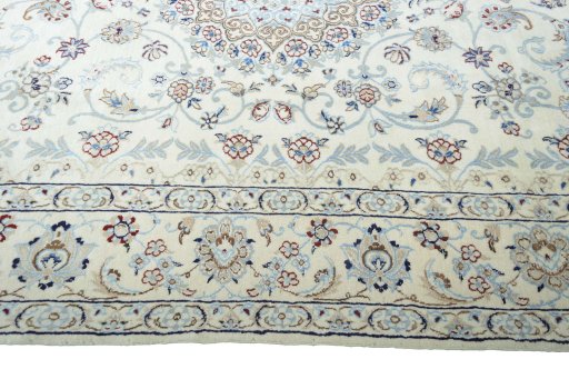 Corner detail of 2000s Nain rug showing border pattern and Wool pile