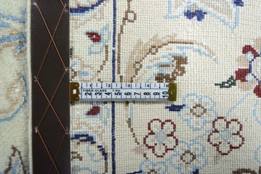 Backside of handmade 2000s Nain rug showing knot structure and weave density