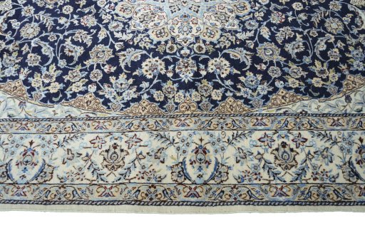 Corner detail of 2000s Nain rug showing border pattern and Cork pile