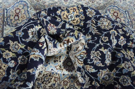Surface texture of 2000s Nain rug with natural Cork and intricate pattern