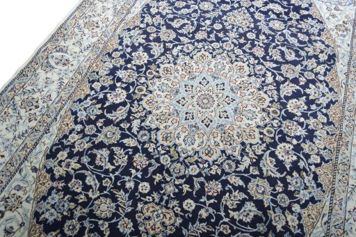 Backside of handmade 2000s Nain rug showing knot structure and weave density