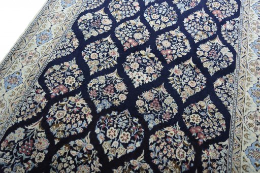 Backside of handmade New Nain rug showing knot structure and weave density