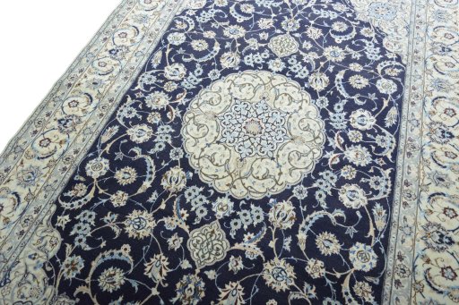 Backside of handmade New Nain rug showing knot structure and weave density