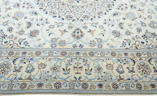 Corner detail of New Nain rug showing border pattern and Wool pile