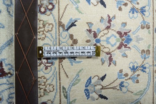 Backside of handmade New Nain rug showing knot structure and weave density