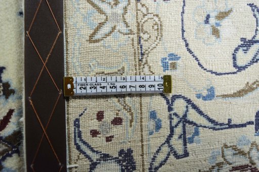 Backside of handmade New Nain rug showing knot structure and weave density