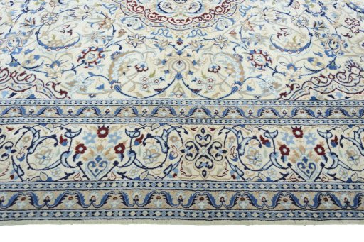 Corner detail of 2000s Nain rug showing border pattern and Wool pile