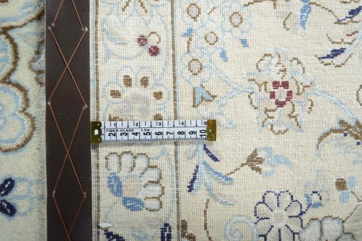 Backside of handmade New Nain rug showing knot structure and weave density