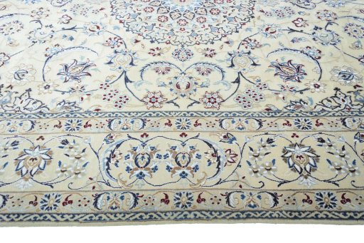 Corner detail of New Nain rug showing border pattern and Wool pile