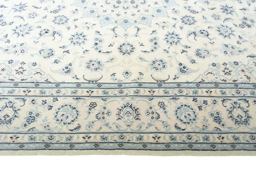 Corner detail of New Nain rug showing border pattern and Wool pile
