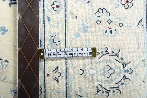 Backside of handmade New Nain rug showing knot structure and weave density