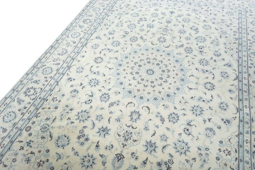 Backside of handmade New Nain rug showing knot structure and weave density