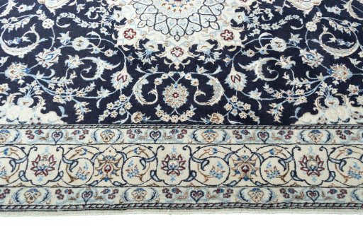 Corner detail of New Nain rug showing border pattern and Wool pile