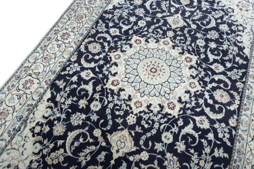 Backside of handmade New Nain rug showing knot structure and weave density