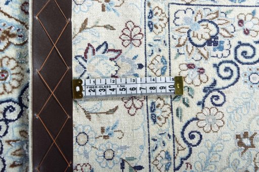 Backside of handmade New Nain rug showing knot structure and weave density