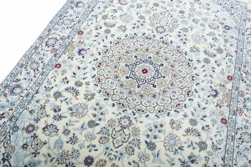 Backside of handmade New Nain rug showing knot structure and weave density