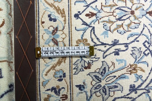 Backside of handmade New Nain rug showing knot structure and weave density