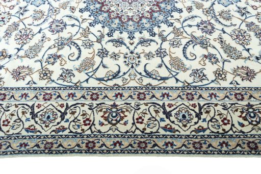 Corner detail of New Nain rug showing border pattern and Wool pile