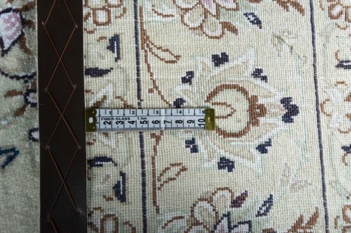 Backside of handmade New Nain rug showing knot structure and weave density