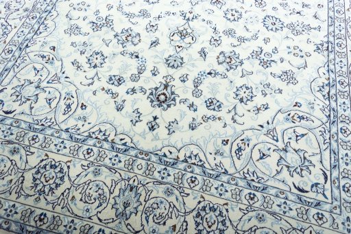 Backside of handmade New Nain rug showing knot structure and weave density