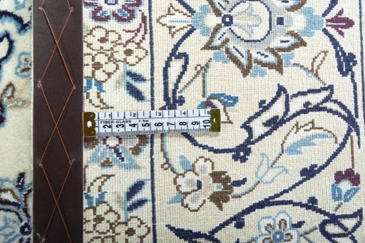 Backside of handmade New Nain rug showing knot structure and weave density