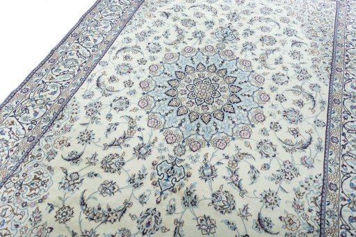 Backside of handmade New Nain rug showing knot structure and weave density