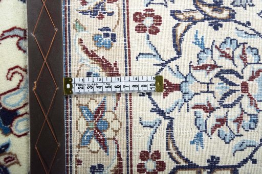 Backside of handmade New Nain rug showing knot structure and weave density