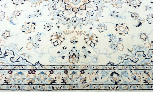 Corner detail of New Nain rug showing border pattern and Wool pile