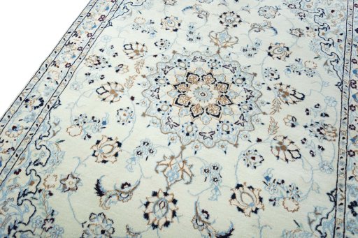 Backside of handmade New Nain rug showing knot structure and weave density