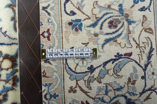 Backside of handmade New Nain rug showing knot structure and weave density