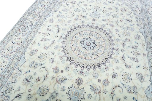Backside of handmade New Nain rug showing knot structure and weave density