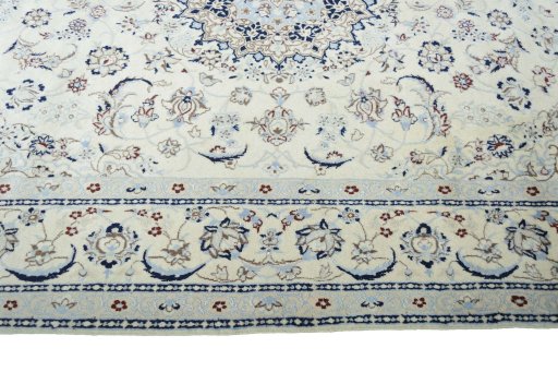 Corner detail of New Nain rug showing border pattern and Wool pile