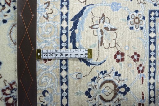 Backside of handmade New Nain rug showing knot structure and weave density